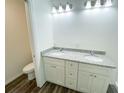 Updated bathroom featuring granite countertops, double sinks, and modern fixtures, complementing the overall aesthetic at 1 Pine Radial Trl, Ocala, FL 34472