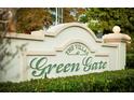 Close up of the Villas at Green Gate community sign with green shrubbery in front of it at 1024 Green Gate Blvd, Groveland, FL 34736