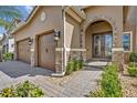 Inviting front entrance with stone accents, double doors, and well-manicured landscaping at 13067 Woodford St, Orlando, FL 32832