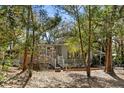 Cozy single-story home with lovely porch, white railing and blossoming plants at 144 E Plantation Blvd, Lake Mary, FL 32746
