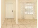 Inviting living room with neutral tile floors, a large window, and ample natural light at 164 Reserve Cir # 208, Oviedo, FL 32765