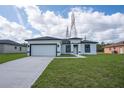 Charming single-story home with a two-car garage and well-manicured lawn at 17046 Sw 44Th Cir, Ocala, FL 34473