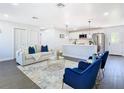 Bright living room featuring an open-concept design with modern furnishings and stainless steel appliances at 2411 Crawford Dr, Sanford, FL 32771
