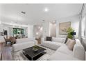 Bright living room features modern furniture, stylish decor, and an open floor plan at 38 W Harding St # C, Orlando, FL 32806