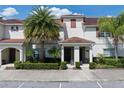 Charming townhome with a tile roof and well-maintained landscaping. Enjoy the Florida lifestyle! at 4895 Clock Tower Dr, Kissimmee, FL 34746