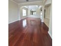 Spacious living room featuring gleaming hardwood floors and modern recessed lighting at 13413 Zori Ln, Windermere, FL 34786