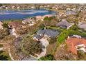 Aerial view of property showing lake, home, and landscaping, including a glimpse of the screened in lanai at 1704 Kersley Cir, Lake Mary, FL 32746