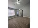 Bedroom with wood-look flooring and a ceiling fan at 2207 Antigua Pl # 736, Kissimmee, FL 34741