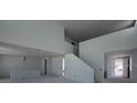 Spacious living room with tall ceilings, many windows, and an open floor plan at 30113 Misty Pines Rd, Mount Dora, FL 32757