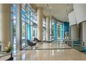 The building lobby features tile floors, large columns, and floor to ceiling windows at 322 E Central Blvd # 1910, Orlando, FL 32801