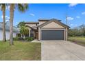 Charming two-story home with a well-manicured lawn and a spacious two-car garage at 3509 S Saint Lucie Dr, Casselberry, FL 32707