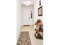 Welcoming entryway features a neutral color scheme, tile flooring, and stylish decorative elements at 780 Livestock Loop, St Cloud, FL 34771