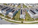 Aerial view featuring modern homes and well-manicured lawns in a residential neighborhood at 9747 Petition Way, Orlando, FL 32832