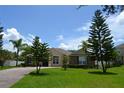 Inviting home with manicured lawn and mature trees enhancing curb appeal at 4847 Lake Milly Dr, Orlando, FL 32839
