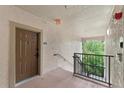 Condominium entrance featuring a private walkway and stylish, secure front door at 1375 Tuscana Ln # 1406, Davenport, FL 33896