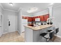 Bright kitchen with updated appliances, granite countertops, and breakfast bar at 1375 Tuscana Ln # 1406, Davenport, FL 33896