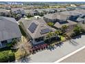 Aerial view of home with solar panels, covered patio and well maintained landscaping at 16144 Parkwyn St, Winter Garden, FL 34787
