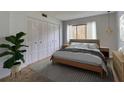 Bright bedroom features a large window, spacious closet, and soft, neutral tones at 3242 S Semoran Blvd # 21, Orlando, FL 32822