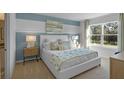 Bright bedroom with a large window, stylish furnishings, and a serene atmosphere at 3901 Diving Dove Ln, Bartow, FL 33830