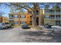 A full exterior view of the condos showcasing parking and outdoor living spaces at 5144 City St # 238, Orlando, FL 32839