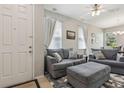 Cozy living room with plenty of natural light and comfortable seating at 612 Old Pine Ct, Sanford, FL 32773