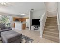 Inviting open floor plan seamlessly connecting the living room and kitchen at 612 Old Pine Ct, Sanford, FL 32773