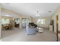Spacious living room featuring neutral tones, plush carpet, and ample natural light at 6133 Seagull Ln, Lakeland, FL 33809