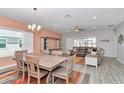 Open concept dining area features stylish furniture, ample space, and seamlessly connects to the living room at 7699 Sw 74Th Loop, Ocala, FL 34481