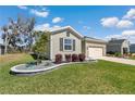 Charming single-Gathering home boasts a landscaped front yard and attached two-car garage at 7699 Sw 74Th Loop, Ocala, FL 34481