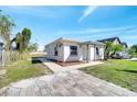 Charming front exterior showcasing updated landscaping and a well-maintained lawn, enhancing curb appeal and inviting entry at 859 Neuse Ave, Orlando, FL 32804