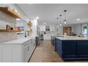 Modern kitchen featuring custom cabinets, stainless steel appliances and a large island at 9235 Everwood St, Orlando, FL 32825