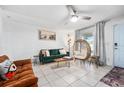 Open living area featuring tile floors, eclectic seating, and ample natural light at 1315 Overdale St, Orlando, FL 32825