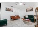 Bright living room with tile flooring, stylish sofas, and a unique live-edge coffee table at 1315 Overdale St, Orlando, FL 32825