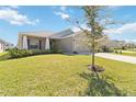 Charming single-story home with well-maintained lawn and landscaping in a quiet neighborhood at 1575 Eucalyptus Way, Davenport, FL 33837