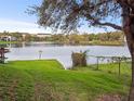 Scenic lake view with lush green grass and trees, complemented by serene waterfront ambiance at 200 Maitland Ave # 228, Altamonte Springs, FL 32701