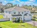 Beautiful two-story home with a spacious yard and attached three-car garage at 2189 Weatherly Way, Orlando, FL 32820