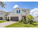 Lovely two-story house with a two-car garage and brick driveway, set in a well-manicured neighborhood at 2817 Noble Crow Dr, Kissimmee, FL 34744