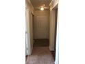 Well-lit hallway featuring carpet and a neutral color palette to give the home a clean and modern look at 3714 Palm Desert Ln # 5337, Orlando, FL 32839
