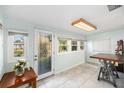 Light and bright entryway featuring a leaded glass front door and tile floors at 430 E Crystal Lake St, Orlando, FL 32806