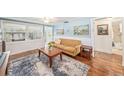 Cozy living room with hardwood floors, an area rug, and lots of natural light at 430 E Crystal Lake St, Orlando, FL 32806