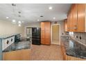 Bright eat-in kitchen featuring tile floors, stainless appliances and plenty of cabinet space at 6331 Lake Lerla Dr, Apopka, FL 32712