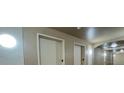 Interior hallway with modern elevators, ensuring easy access to all floors of the building at 6451 Old Park Ln # 302, Orlando, FL 32835