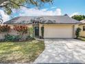 Charming single-story home with a well-maintained lawn and a two-car garage, offering curb appeal at 734 Adidas Rd, Winter Springs, FL 32708