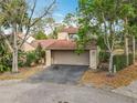 Charming two-story home with a garage and lush landscaping and a cozy, well-maintained front yard at 117 Starling Ln, Longwood, FL 32779
