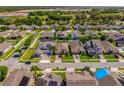 Spacious suburban neighborhood featuring well-maintained homes and green spaces at 1703 Leatherback Ln, St Cloud, FL 34771