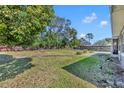 Expansive backyard featuring mature trees and offering ample green space at 2019 Loch Berry Rd, Winter Park, FL 32792