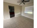 The Living room features tile floors and a ceiling fan at 204 W Cottesmore Cir, Longwood, FL 32779