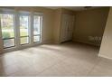 Bright living room featuring tile flooring and large windows at 204 W Cottesmore Cir, Longwood, FL 32779