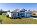 Lovely single-story home featuring a neatly landscaped yard and a two-car attached garage at 4590 Sw 99Th St, Ocala, FL 34476