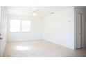 Bright living room with neutral paint, tile floors, and natural light at 4840 Transport Rd, Bartow, FL 33830
